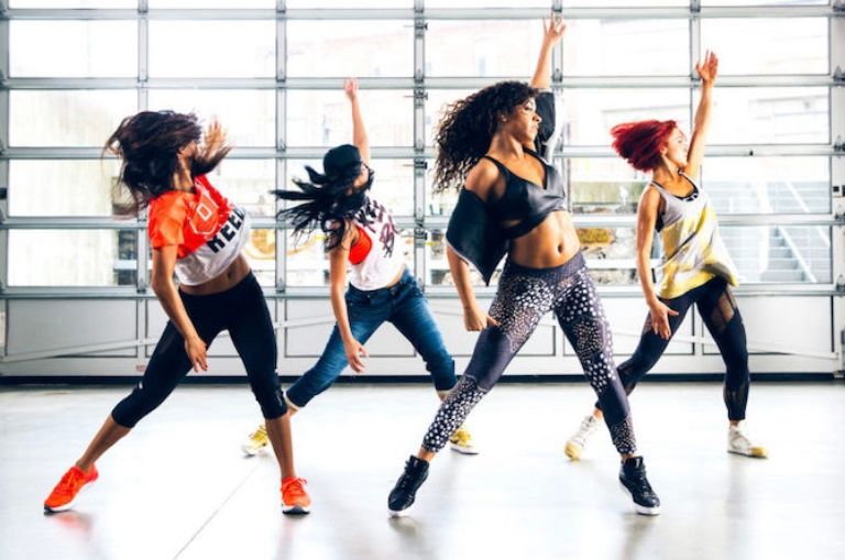 Young woman practicing dance moves in a studio